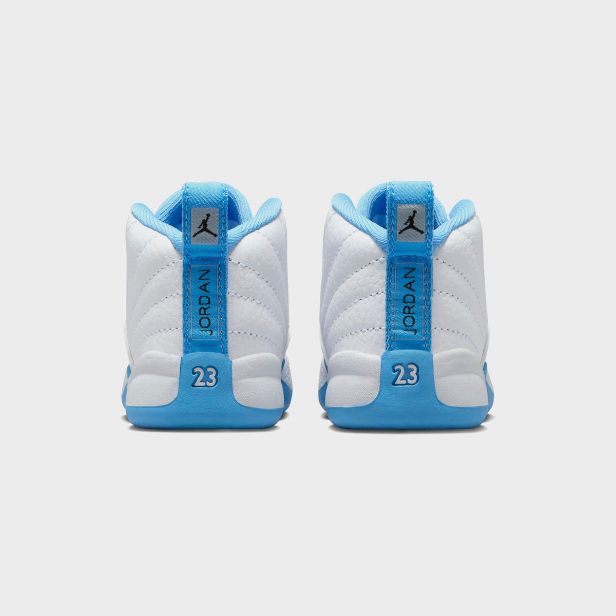 Jordan TD Jordan 12 Retro - White / Metallic Silver / University Blue | Kith